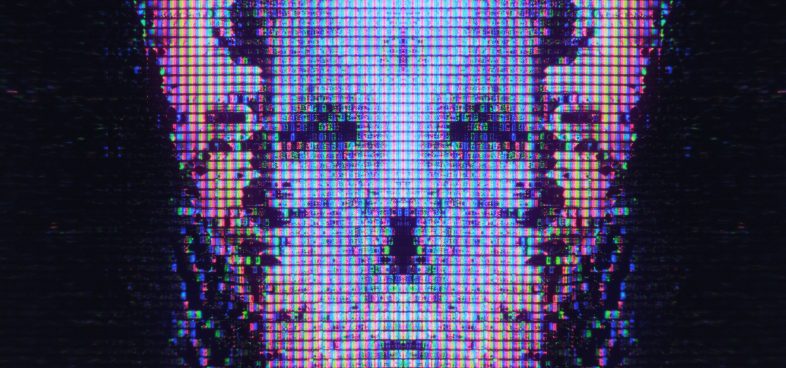 Pictorial representation of Gremlin Stealer hiding in plain sight. Close-up view of a digital screen displaying a glitched and pixelated image of a skull-like shape.